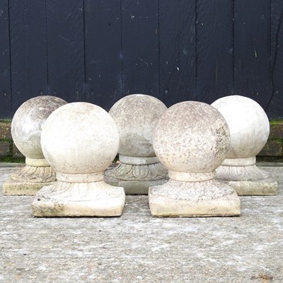 Lot 1 - A collection of five cast stone ball markers,...