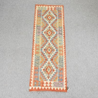 Lot 186 - A kelim runner