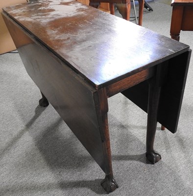 Lot 123 - An early 20th century oak pembroke table, on...