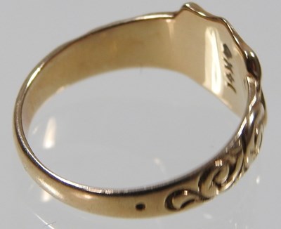 Lot 15 - A 9 carat gold signet ring, the central shield...