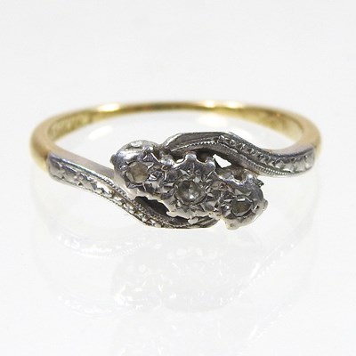 Lot 101 - An 18 carat gold and platinum set three stone...