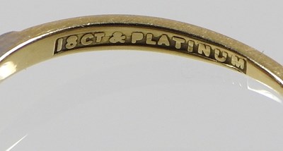Lot 101 - An 18 carat gold and platinum set three stone...
