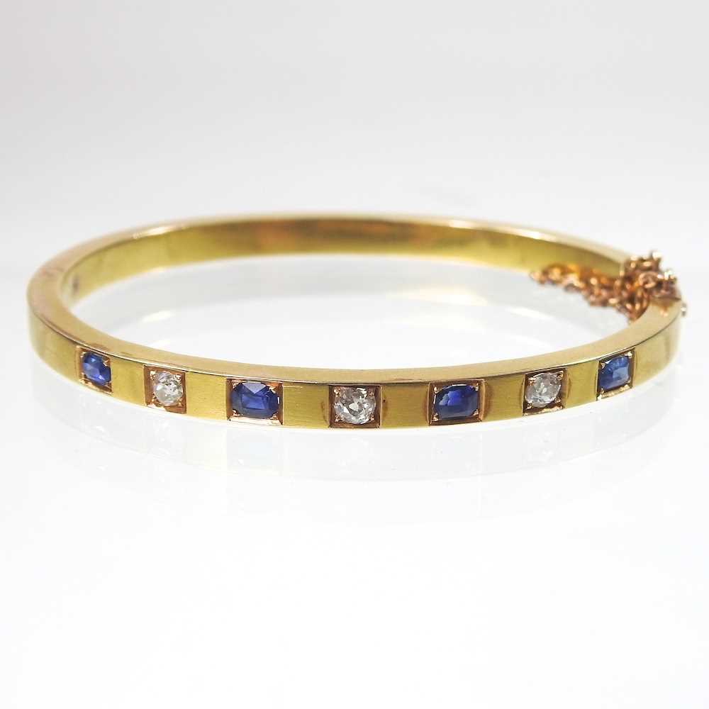 Lot 56 - An early 20th century 18 carat gold sapphire...