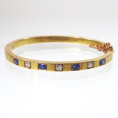 Lot 56 - An early 20th century 18 carat gold sapphire...