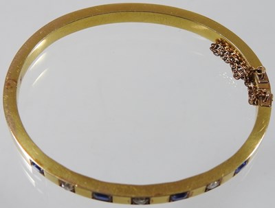 Lot 56 - An early 20th century 18 carat gold sapphire...