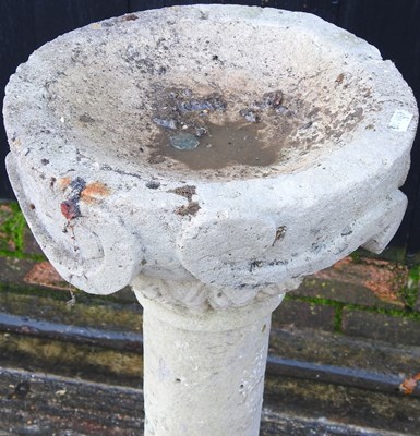 Lot 72 - A cast stone bird bath, 83cm high