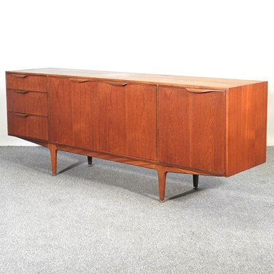 Lot 19 - A 1970's teak sideboard, on turned legs, by...