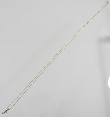 Lot 55 - A 9 carat gold princess cut diamond pendant,...