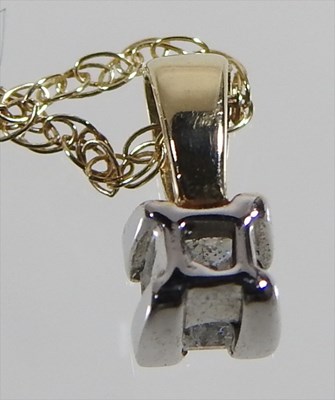 Lot 55 - A 9 carat gold princess cut diamond pendant,...