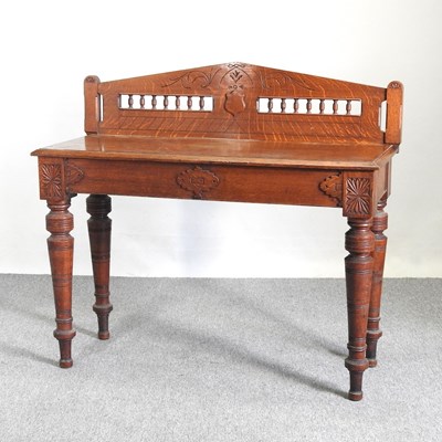 Lot 96 - An Edwardian oak side table, with a gallery...