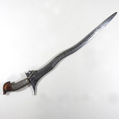 Lot 90 - A 19th century Eastern kris, having a bound...