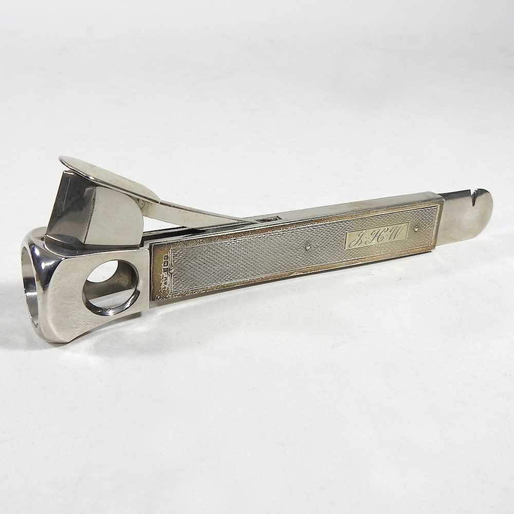 Lot 50 - A modern silver cigar cutter, with engine...