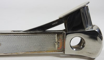 Lot 50 - A modern silver cigar cutter, with engine...