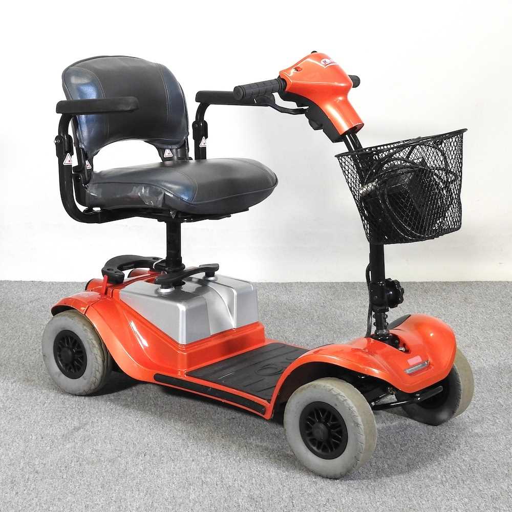 Lot 21 - An orange Kymco electric mobility scooter,...