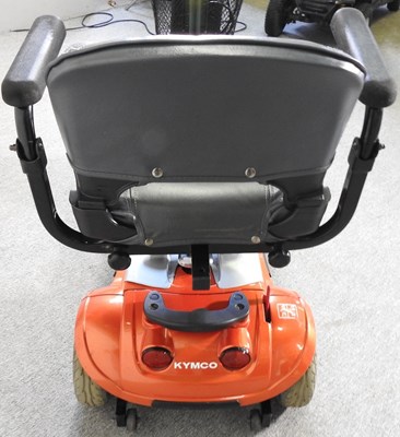 Lot 21 - An orange Kymco electric mobility scooter,...