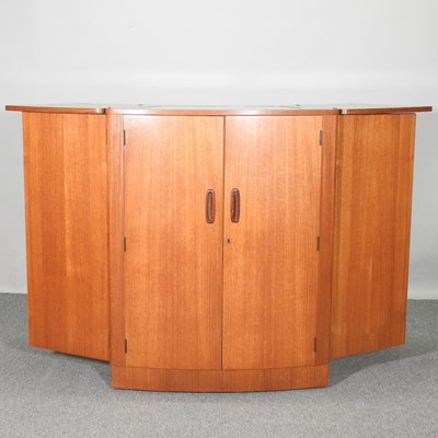 Lot 53 - A 1960's teak curved envelope cocktail bar,...