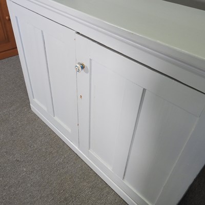 Lot 76 - A blue painted pine dresser base, on a plinth...