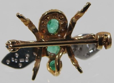 Lot 45 - A 9 carat gold, emerald and diamond brooch, in...