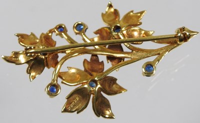 Lot 25 - A 9 carat gold and sapphire brooch, in the...
