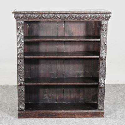 Lot 473 - A 19th century carved oak dwarf open bookcase,...