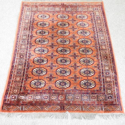 Lot 550 - A Turkoman rug, with three rows of medallions,...