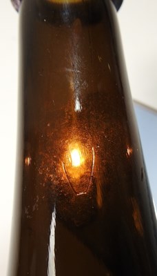 Lot 15 - An 18th century English brown glass sealed...