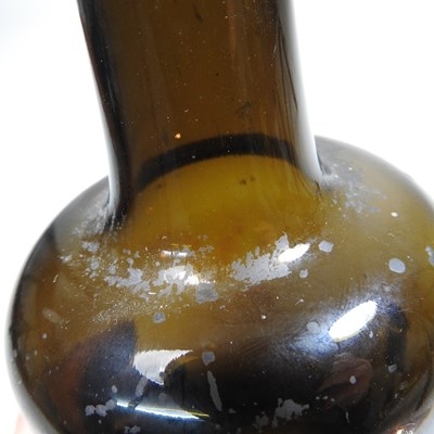 Lot 15 - An 18th century English brown glass sealed...