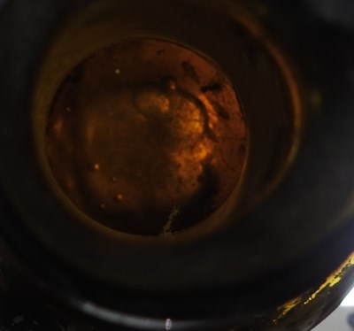 Lot 15 - An 18th century English brown glass sealed...