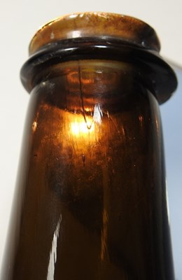 Lot 15 - An 18th century English brown glass sealed...