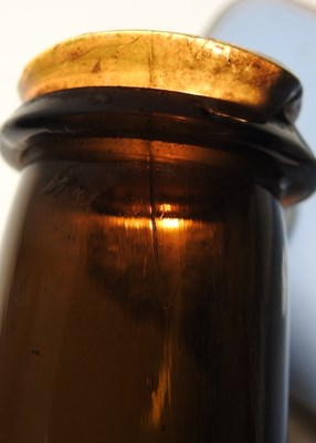 Lot 15 - An 18th century English brown glass sealed...