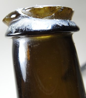 Lot 15 - An 18th century English brown glass sealed...