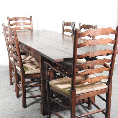 Lot 535 - A modern oak extending refectory dining table,...