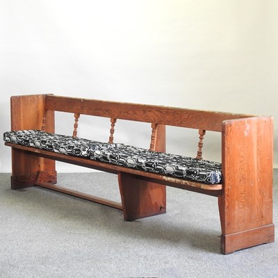 Lot 73 - An antique pine pew