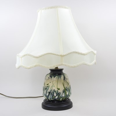 Lot 566 - A Moorcroft pottery table lamp, decorated in...