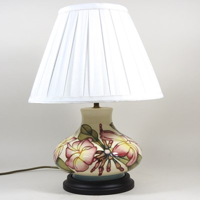Lot 18 - A Moorcroft pottery table lamp, decorated in...