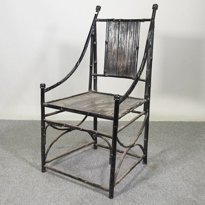 Lot 561 - A black painted bamboo armchair