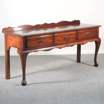 Lot 468 - A mahogany dresser base, containing three...