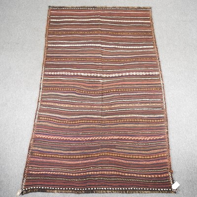 Lot 464 - A Persian kilim rug, with striped design 270 x...