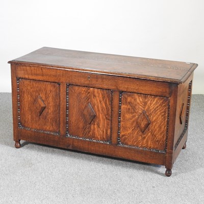 Lot 516 - An early 20th century oak coffer, with a...