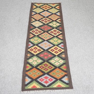 Lot 442 - A kelim runner, with all over coloured diamond...