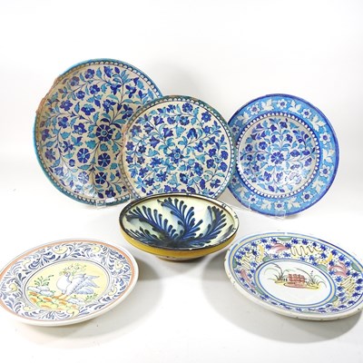 Lot 30 - A Persian iznik tin glazed dish, 38cm diameter,...