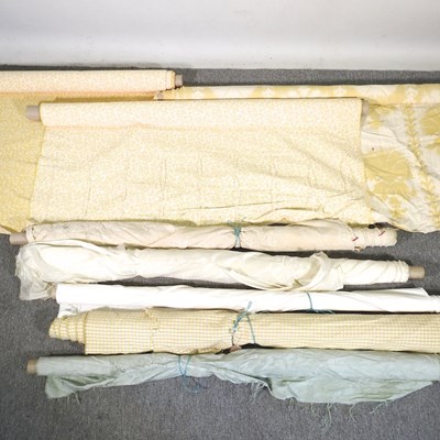 Lot 520 - A collection of rolls of fabric, to include...
