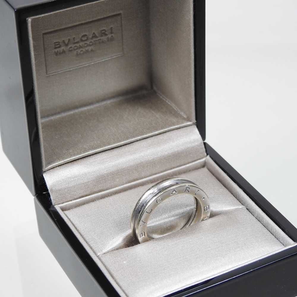 Lot 23 - A Bulgari 18 carat white gold ring, of plain...