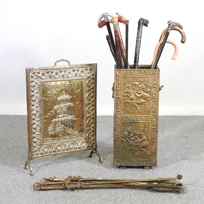 Lot 542 - A brass stick stand, containing a collection...