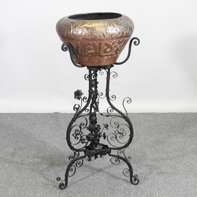 Lot 530 - An Eastern copper jardiniere, on a wrought...