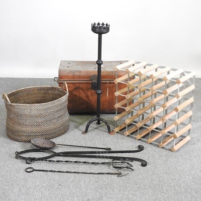Lot 489 - A wooden wine rack, together with a log basket,...