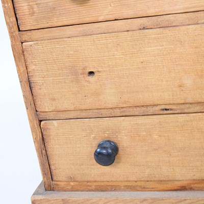 Lot 27 - A Victorian pine miniature chest, containing...