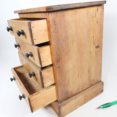 Lot 27 - A Victorian pine miniature chest, containing...