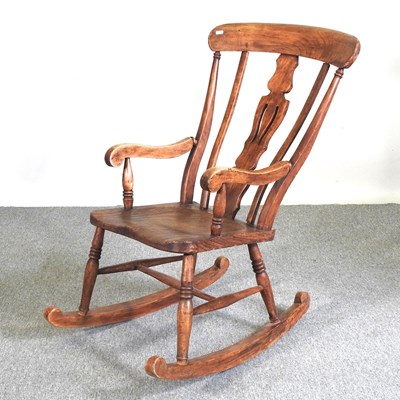 Lot 800 - An early 20th century elm seated splat back...