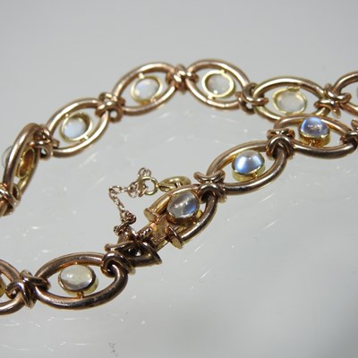 Lot 38 - A 15 carat gold and moonstone fancy link...